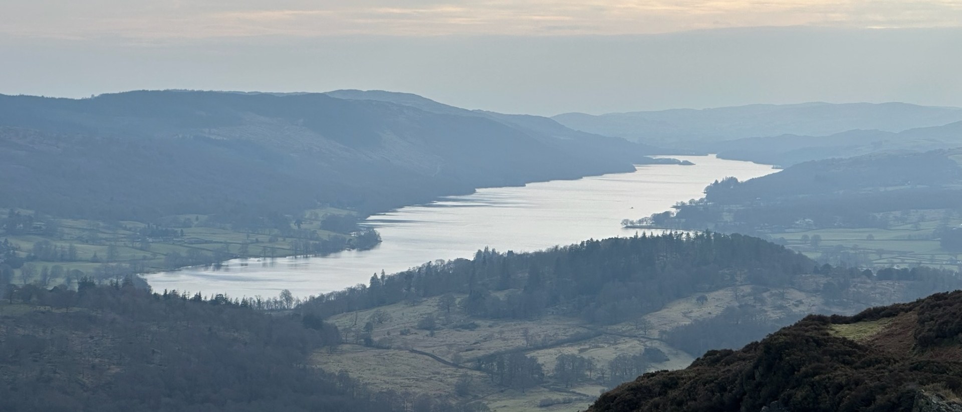 View across a Lake District valley to the lake below
